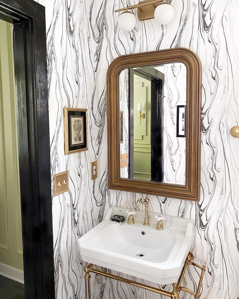 This is an example of a small eclectic powder room in DC Metro with white cabinets, marble floors, wallpaper, a one-piece toilet, marble, white walls, a console sink, marble benchtops, grey floor and a freestanding vanity.