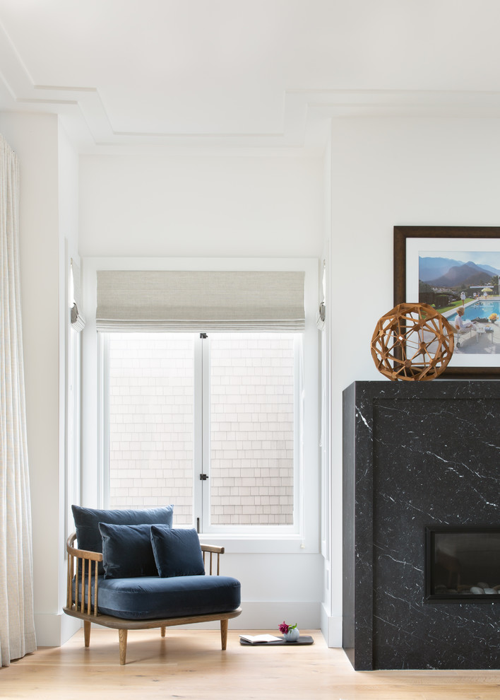 Pacific Heights Collected Contemporary - Intentional. Elevated. Artisanal.
 
With three children under the age of 5, our clients were starting to feel the confines of their Pacific Heights home when the expansive 1902 Italianate across the street went on the market. After learning the home had been recently remodeled, they jumped at the chance to purchase a move-in ready property. We worked with them to infuse the already refined, elegant living areas with subtle edginess and handcrafted details, and also helped them reimagine unused space to delight their little ones.
 
Elevated furnishings on the main floor complement the home’s existing high ceilings, modern brass bannisters and extensive walnut cabinetry. In the living room, sumptuous emerald upholstery on a velvet side chair balances the deep wood tones of the existing baby grand. Minimally and intentionally accessorized, the room feels formal but still retains a sharp edge—on the walls moody portraiture gets irreverent with a bold paint stroke, and on the the etagere, jagged crystals and metallic sculpture feel rugged and unapologetic. Throughout the main floor handcrafted, textured notes are everywhere—a nubby jute rug underlies inviting sofas in the family room and a half-moon mirror in the living room mixes geometric lines with flax-colored fringe. 
 
On the home’s lower level, we repurposed an unused wine cellar into a well-stocked craft room, with a custom chalkboard, art-display area and thoughtful storage. In the adjoining space, we installed a custom climbing wall and filled the balance of the room with low sofas, plush area rugs, poufs and storage baskets, creating the perfect space for active play or a quiet reading session. The bold colors and playful attitudes apparent in these spaces are echoed upstairs in each of the children’s imaginative bedrooms.
 
Architect + Developer: McMahon Architects + Studio, Photographer: Suzanna Scott Photography