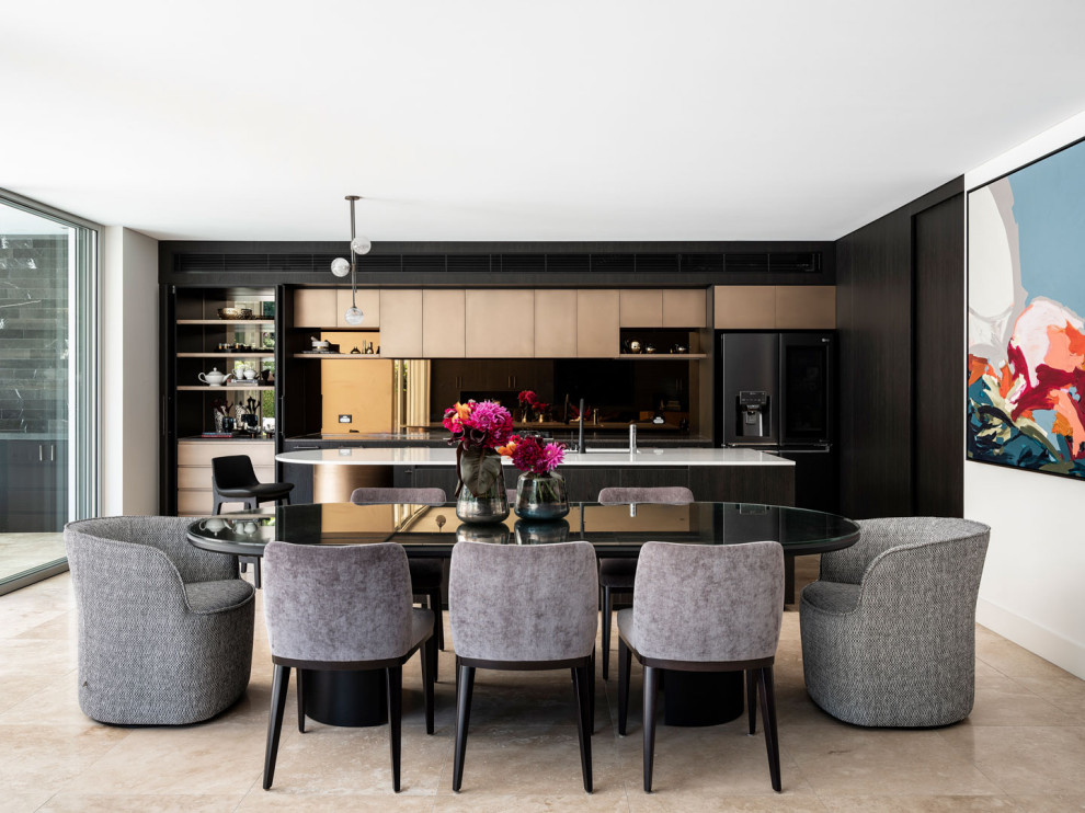 This is an example of a contemporary kitchen/dining combo in Sydney with white walls, no fireplace and beige floor.
