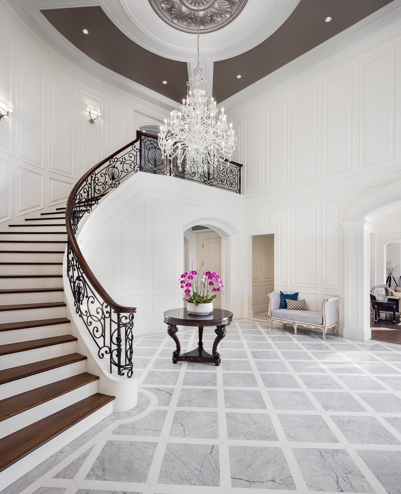 Photo of an expansive traditional foyer in Vancouver with white walls.