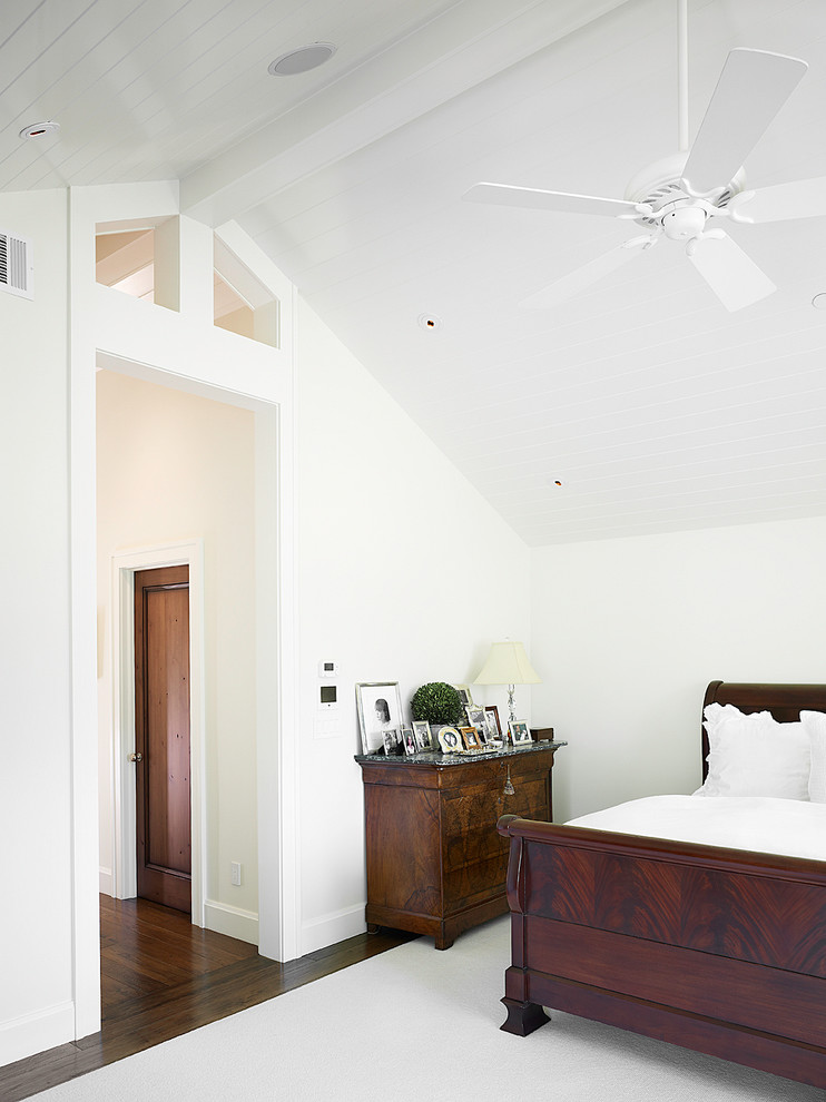 Photo of an arts and crafts master bedroom in San Francisco with white walls and dark hardwood floors.