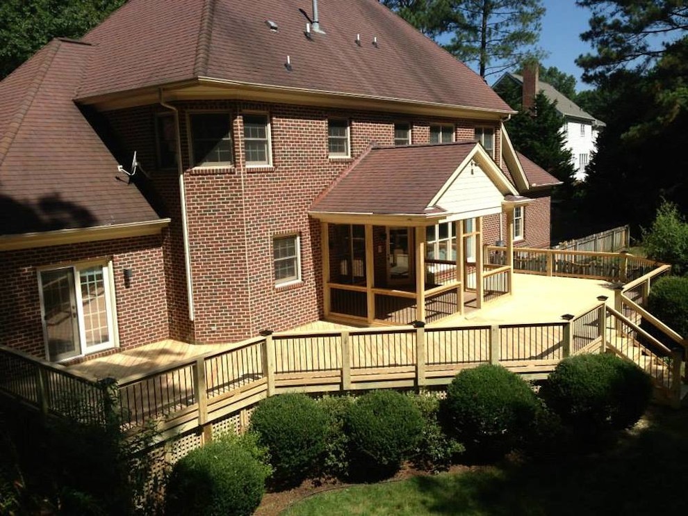 Large transitional backyard deck photo in Raleigh with no cover