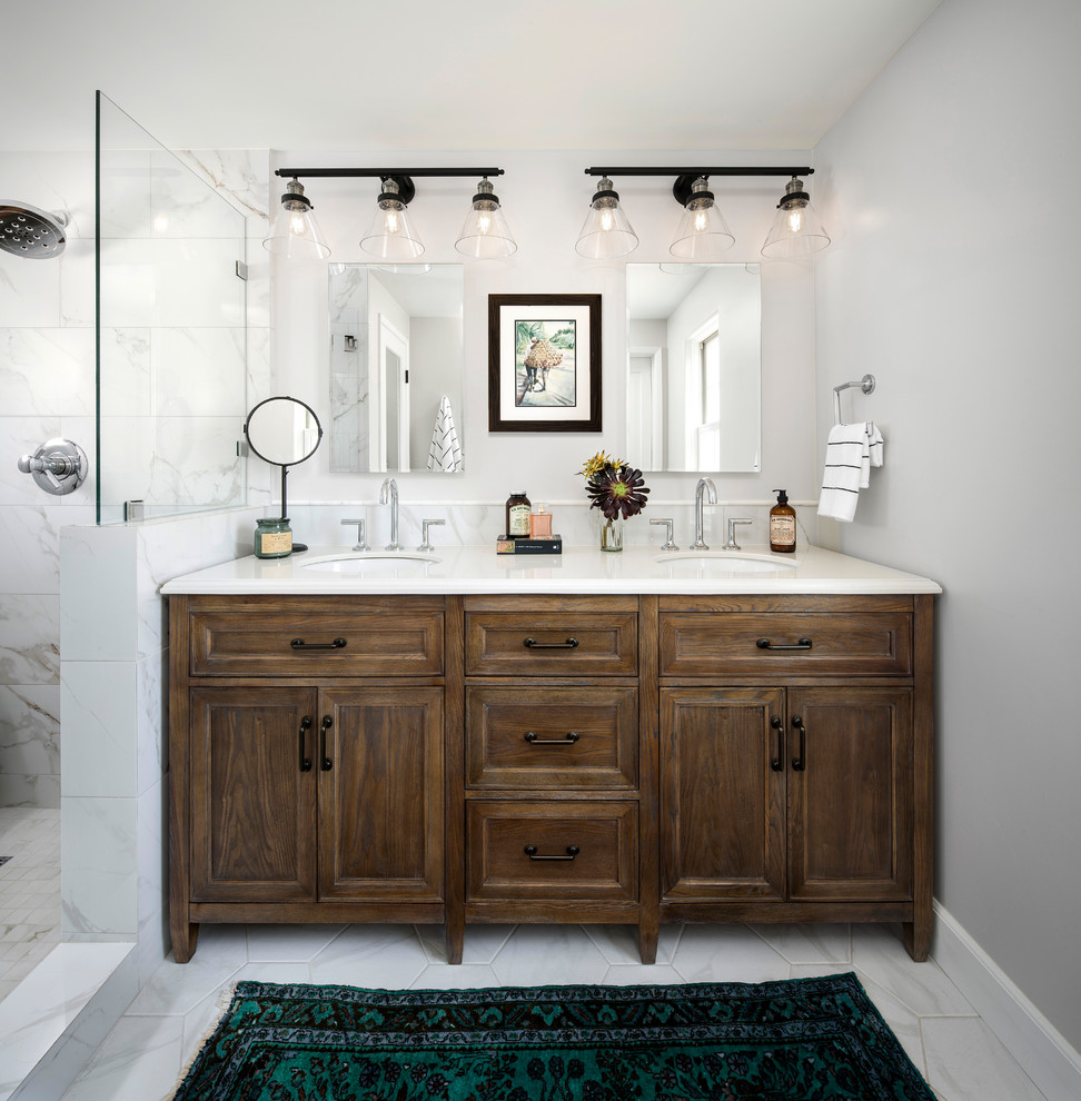 Photo of a mid-sized country master bathroom in San Francisco with distressed cabinets, an alcove shower, a two-piece toilet, multi-coloured tile, marble, grey walls, marble floors, a drop-in sink, engineered quartz benchtops, grey floor, a hinged shower door, recessed-panel cabinets and a freestanding vanity.