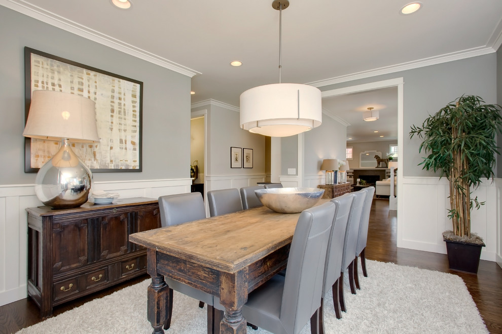Inspiration for an arts and crafts dining room in Seattle with grey walls and medium hardwood floors.