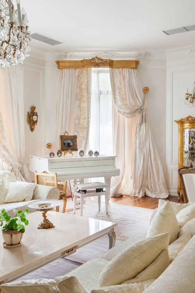 Photo of a traditional living room in Moscow with white walls, carpet and a music area.