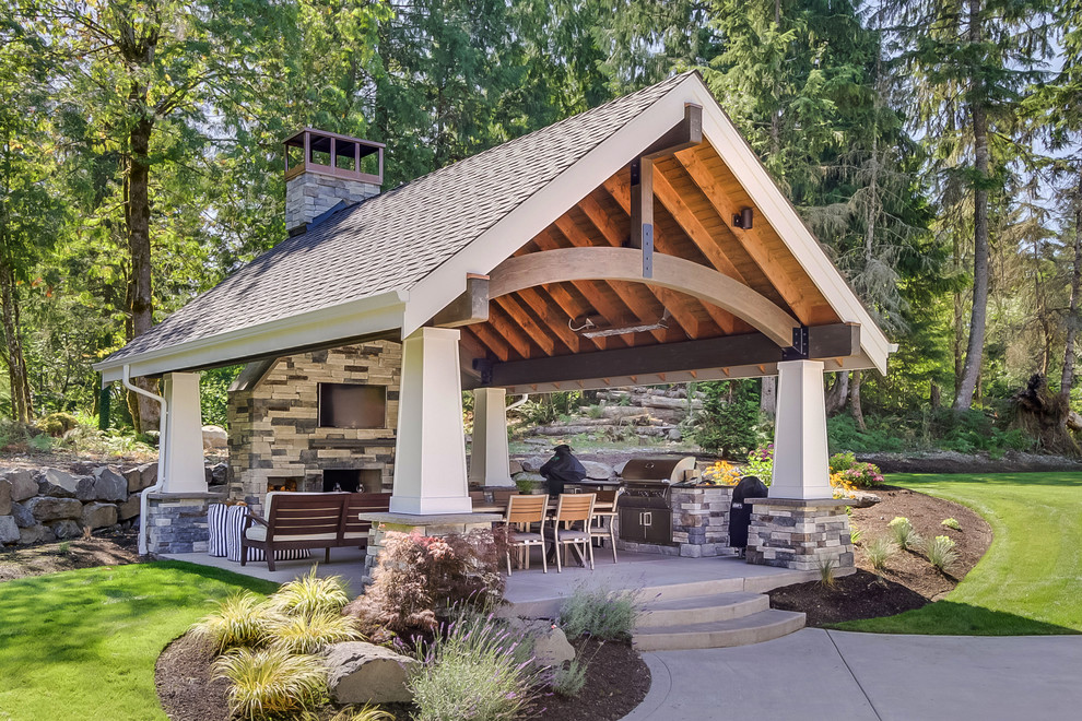 Design ideas for a traditional backyard patio in Seattle with an outdoor kitchen, concrete slab and a gazebo/cabana.