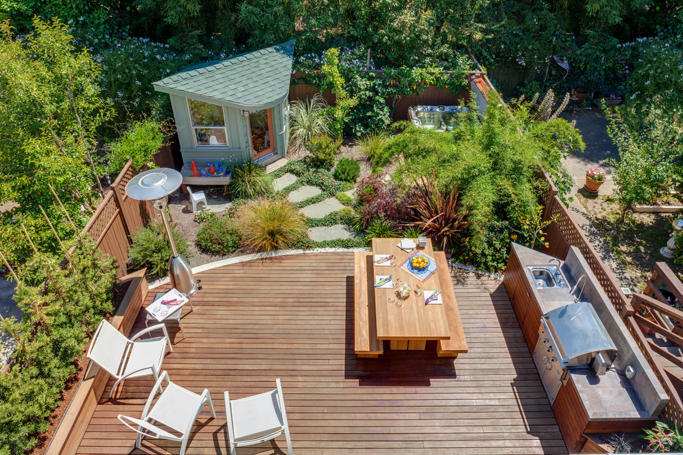 Large transitional backyard patio in San Francisco with an outdoor kitchen, decking and no cover.