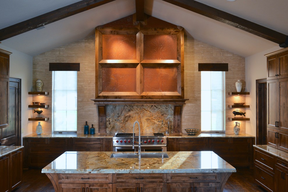 Open concept kitchen - large transitional u-shaped dark wood floor open concept kitchen idea in Dallas with an undermount sink, recessed-panel cabinets, medium tone wood cabinets, granite countertops, beige backsplash, stone tile backsplash, paneled appliances and two islands