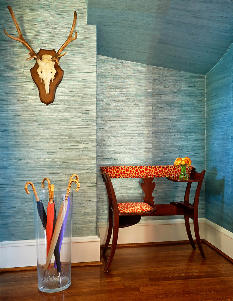 Inspiration for a mid-sized traditional hallway in Charlotte with blue walls and dark hardwood floors.