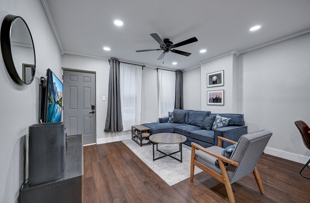 Small danish formal and open concept vinyl floor, brown floor and tray ceiling living room photo in Philadelphia with gray walls, no fireplace and a wall-mounted tv