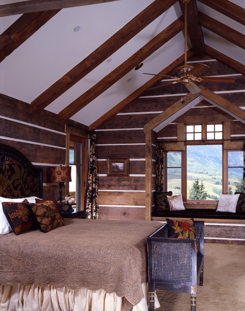 This is an example of a country master bedroom in Denver.