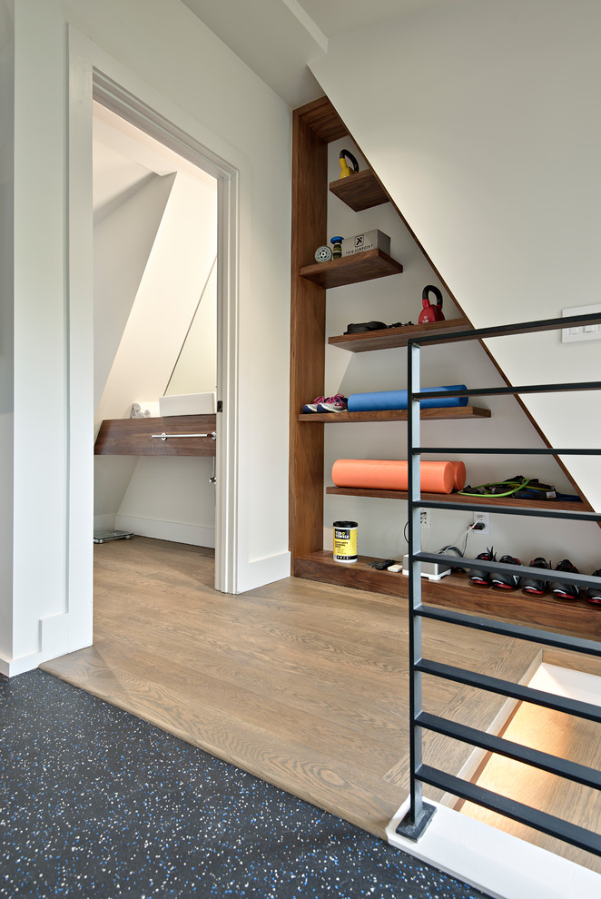 Inspiration for a transitional multipurpose gym in Austin with white walls and black floor.