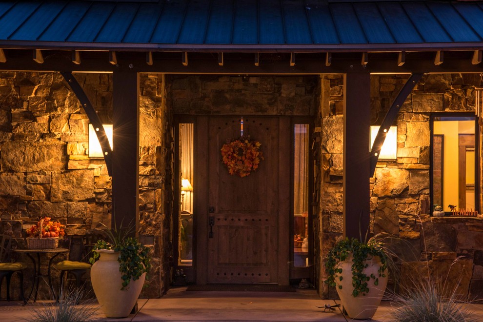 Inspiration for a mid-sized rustic front door remodel with a dark wood front door