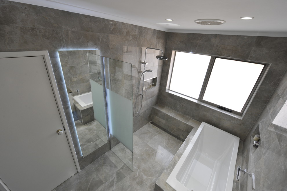 Inspiration for a mid-sized contemporary master bathroom in Melbourne with flat-panel cabinets and beige cabinets.