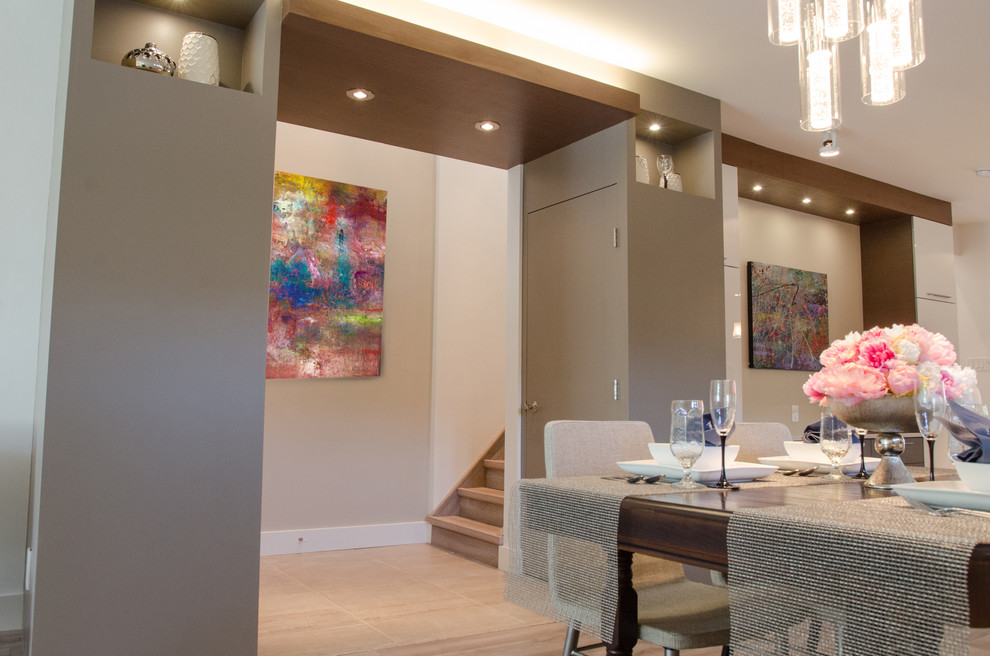 Example of a mid-sized trendy medium tone wood floor kitchen/dining room combo design with white walls