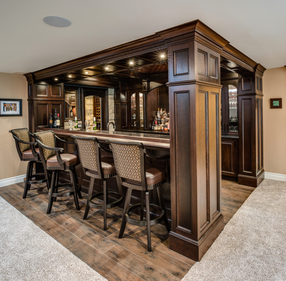 Design ideas for a large transitional home bar in Detroit with porcelain floors and brown floor.