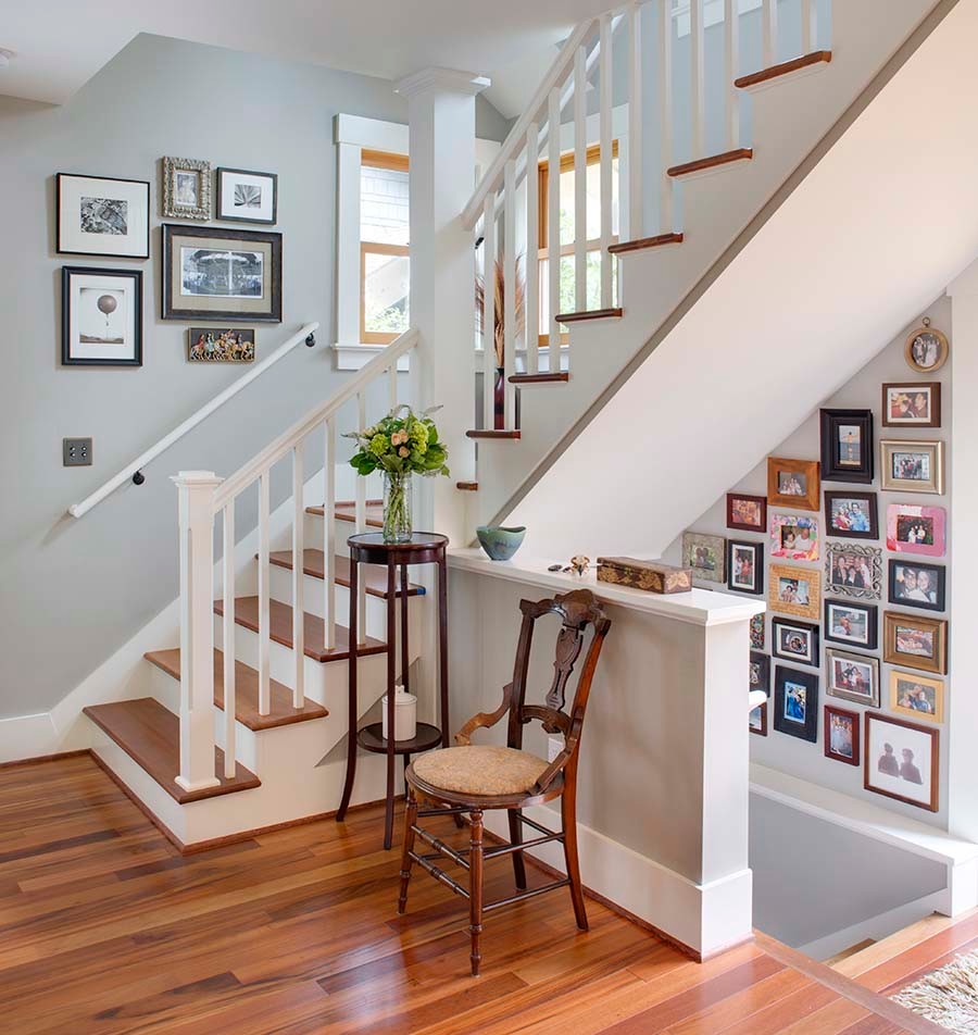 This is an example of a mid-sized traditional wood l-shaped staircase in Portland.