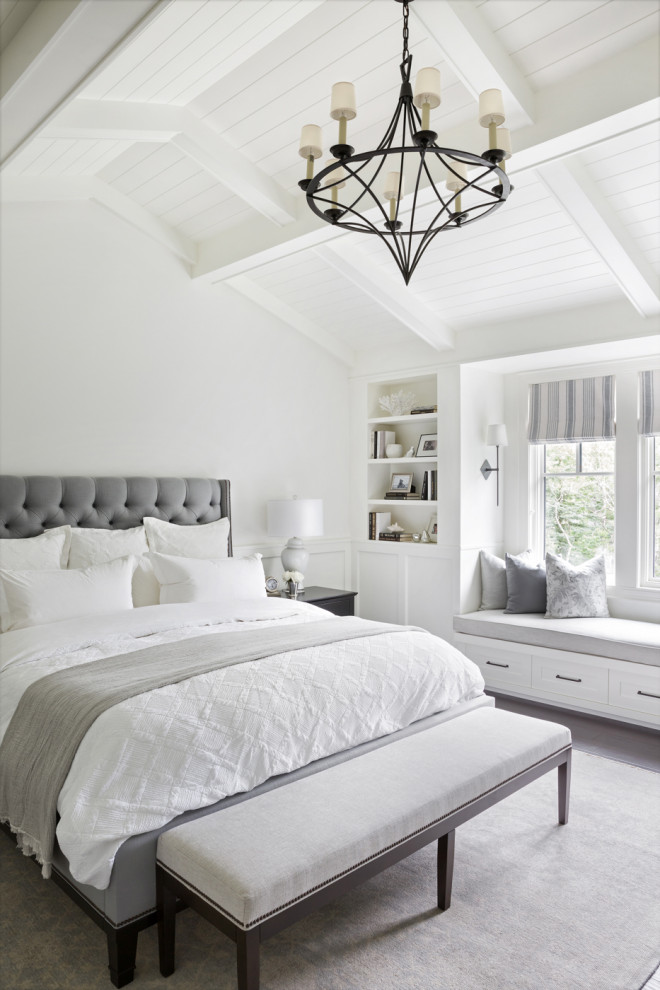 Design ideas for a transitional bedroom in Vancouver with white walls, dark hardwood floors, brown floor and vaulted.