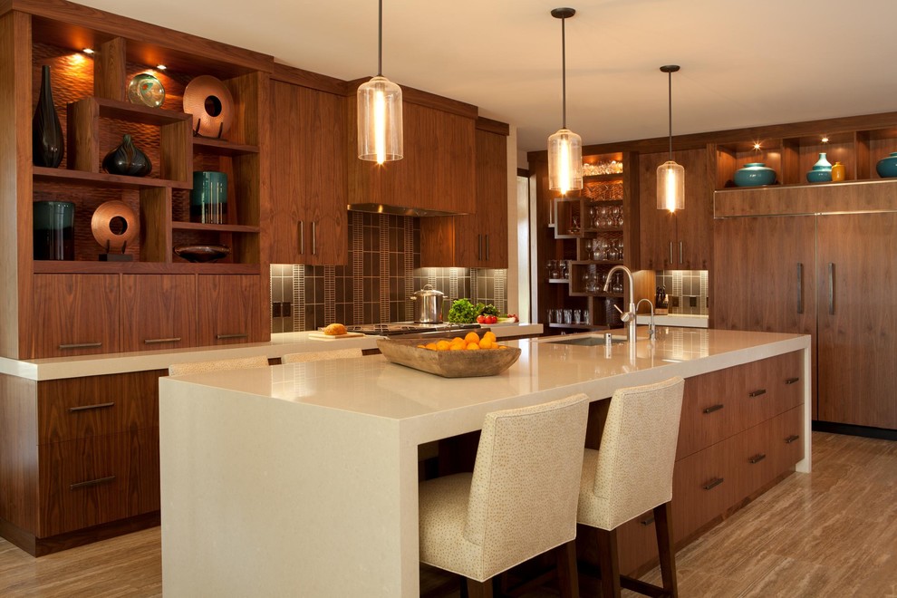 This is an example of a contemporary kitchen in Orange County with panelled appliances, flat-panel cabinets, dark wood cabinets and brown splashback.