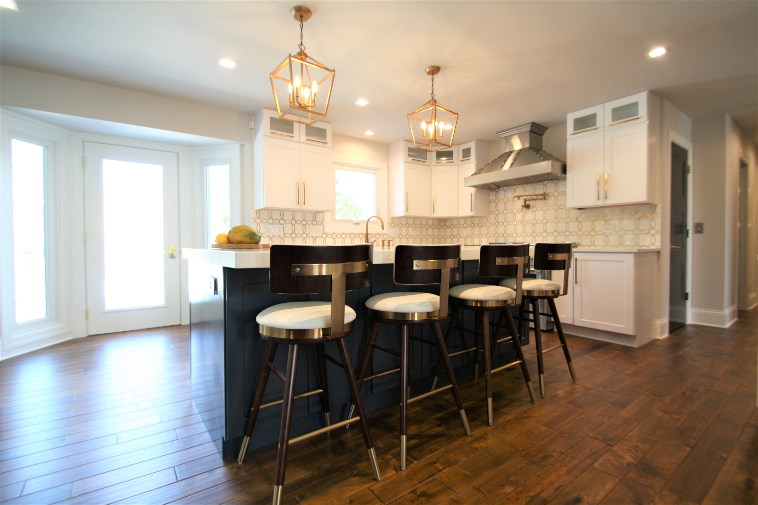 Modern kitchen design and remodel. Shaker style cabinets in white and blue.