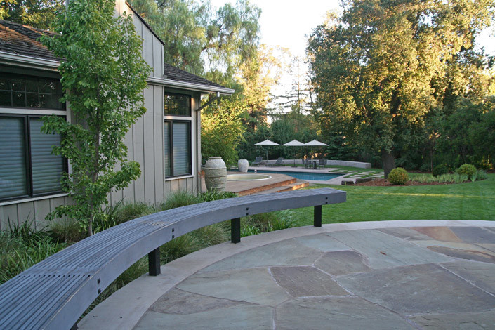 Design ideas for an expansive transitional sloped full sun formal garden for summer in San Francisco with natural stone pavers and a garden path.