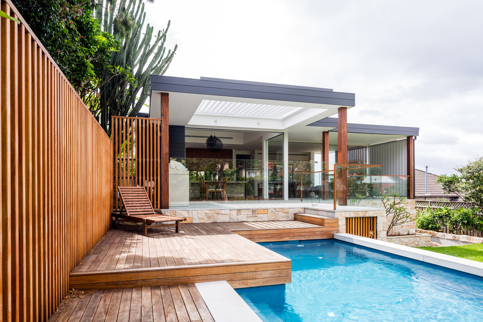 Design ideas for a contemporary backyard custom-shaped lap pool in Sydney.