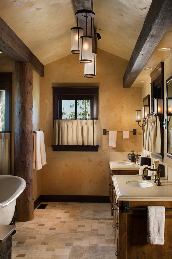 This is an example of a mid-sized country master bathroom in Other with a claw-foot tub, an undermount sink, dark wood cabinets, beige tile, beige floor, shaker cabinets, an alcove shower, ceramic tile, beige walls, ceramic floors, soapstone benchtops and an open shower.
