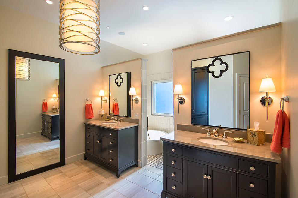 This is an example of a mid-sized transitional master bathroom in Charleston with furniture-like cabinets, dark wood cabinets, a japanese tub, white tile, an undermount sink, a shower/bathtub combo, porcelain tile, beige walls, ceramic floors, marble benchtops, beige floor and an open shower.