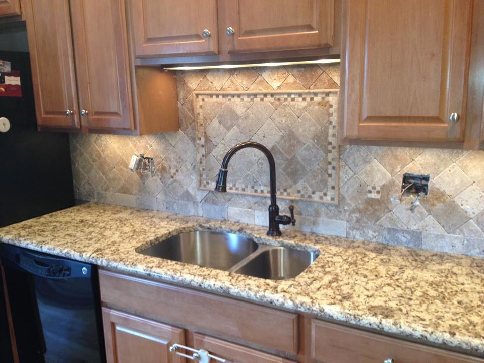 Kitchen - mid-sized single-wall kitchen idea in Bridgeport with a double-bowl sink, raised-panel cabinets, light wood cabinets, granite countertops, multicolored backsplash, cement tile backsplash and black appliances