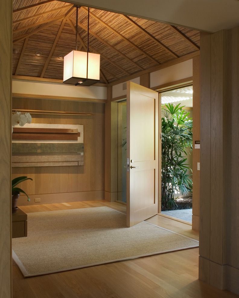Asian foyer in San Diego with light hardwood floors, a single front door and a light wood front door.