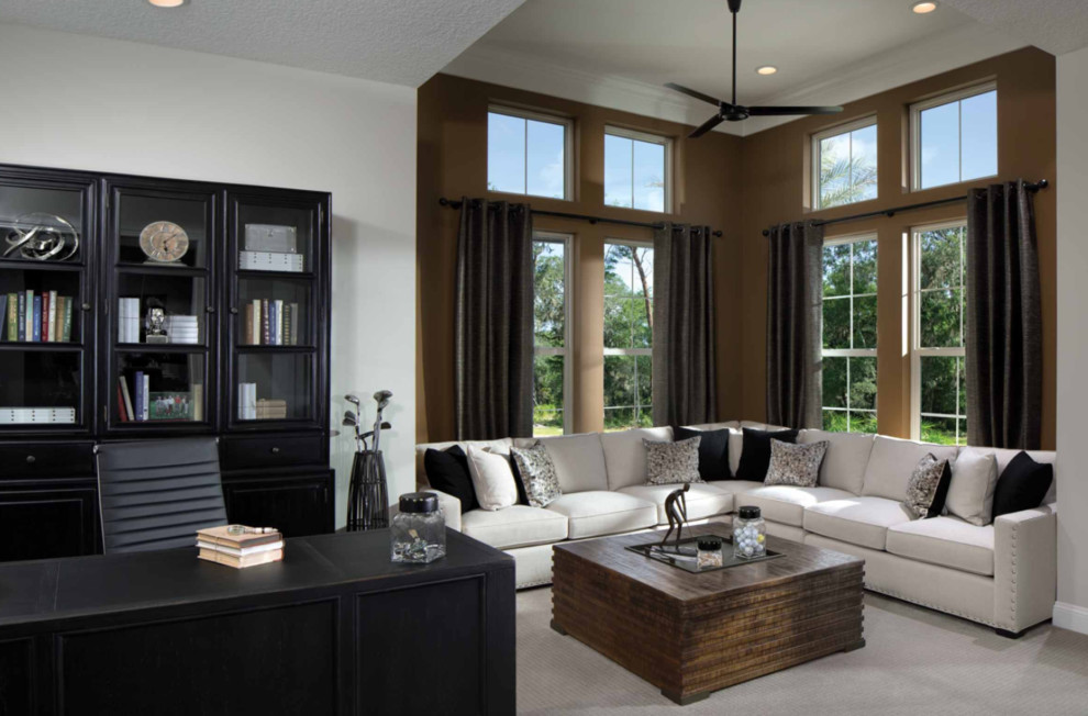 Study room - mid-sized contemporary freestanding desk carpeted and beige floor study room idea in San Diego with brown walls
