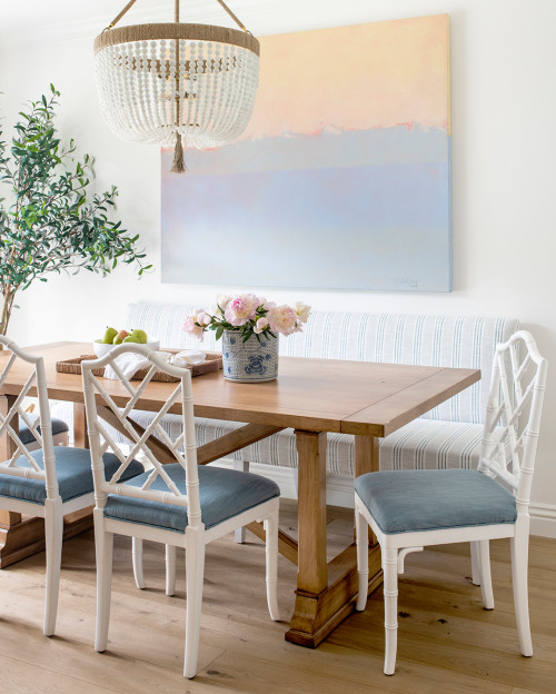 dining room with beach inspired artwork