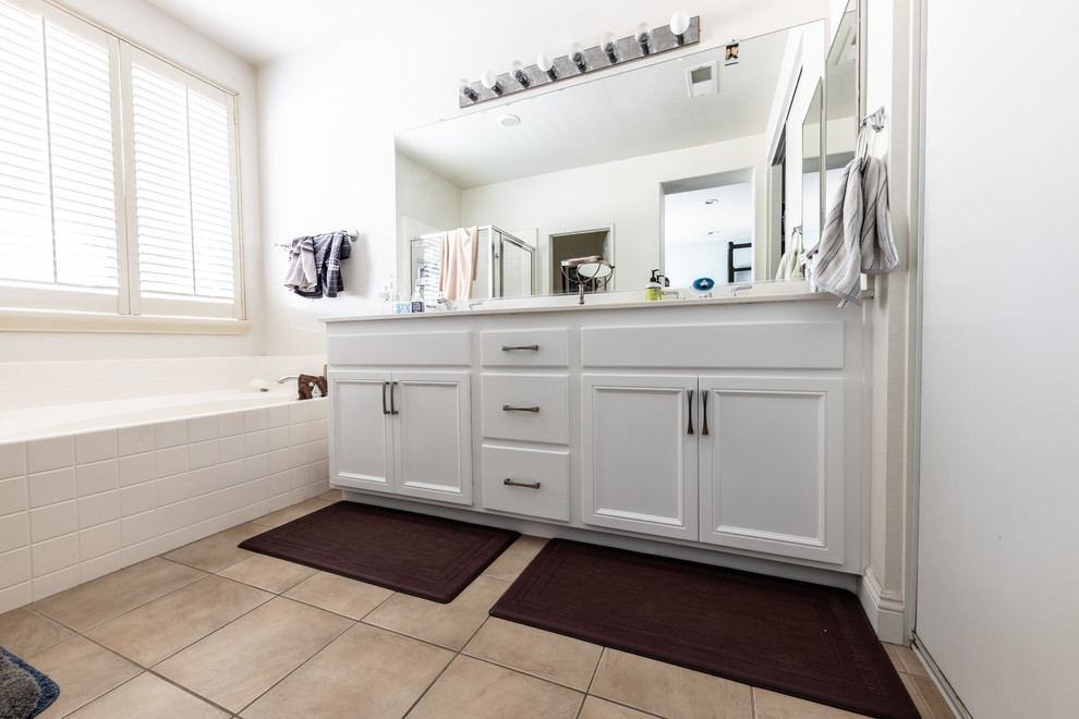Design ideas for a small transitional master bathroom in Other with recessed-panel cabinets, white cabinets, beige walls, porcelain floors, granite benchtops, beige floor and white benchtops.