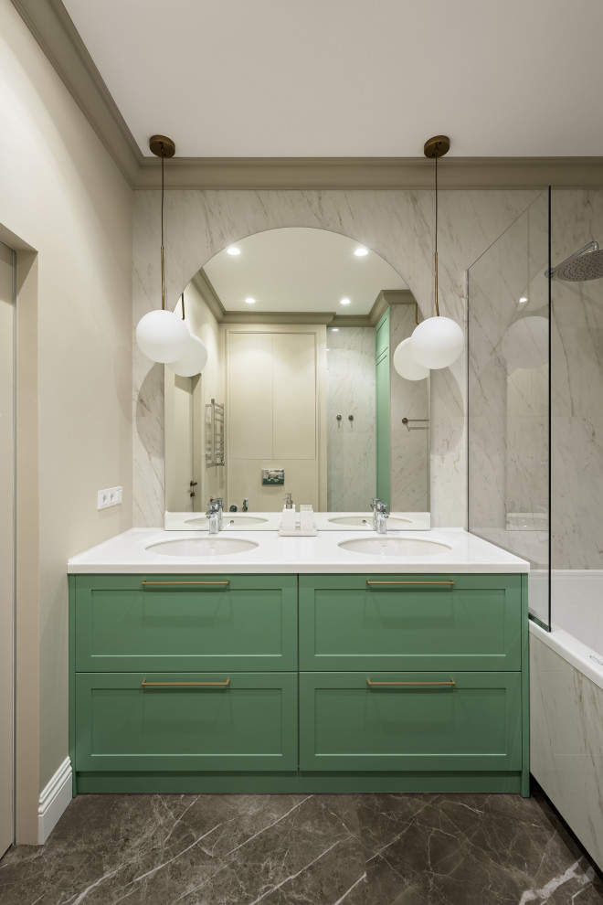 Medium sized traditional ensuite bathroom in Saint Petersburg with raised-panel cabinets, green cabinets, a submerged bath, a wall mounted toilet, white tiles, porcelain tiles, beige walls, ceramic flooring, a submerged sink, solid surface worktops, brown floors, a shower curtain, white worktops, double sinks and a built in vanity unit.