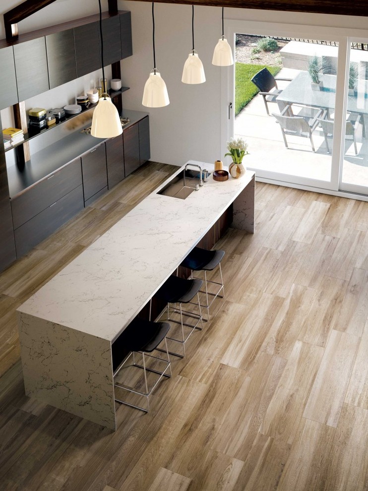 Kitchen - large transitional porcelain tile kitchen idea in Minneapolis with an undermount sink, flat-panel cabinets, dark wood cabinets, marble countertops and an island