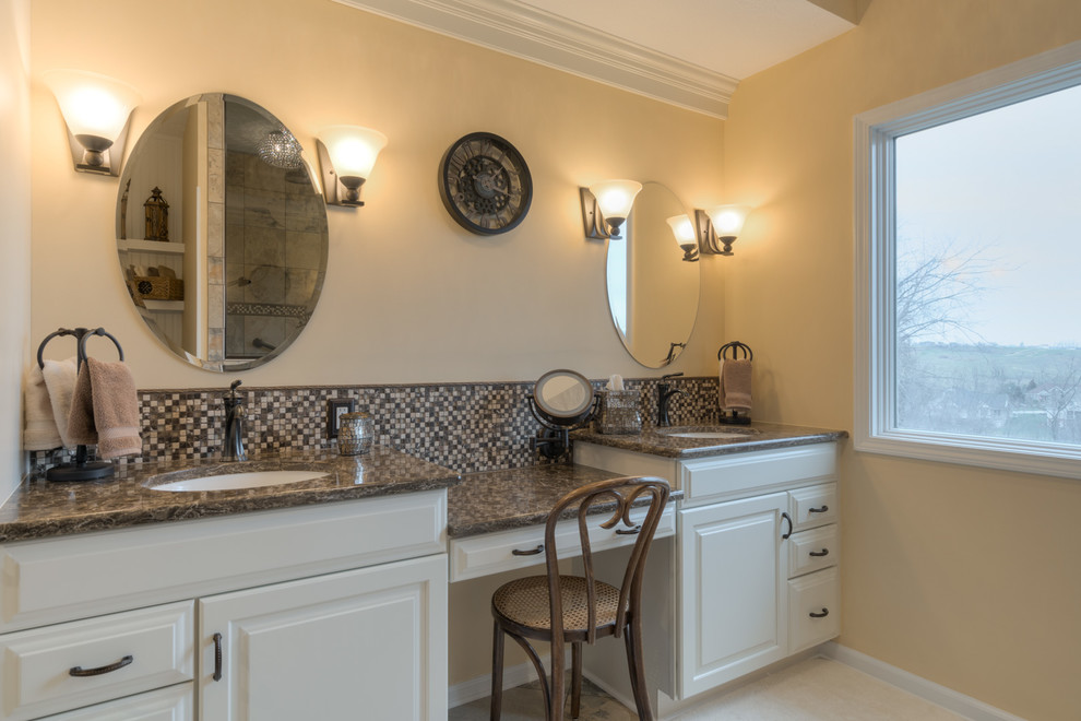 Mid-sized transitional master multicolored tile ceramic tile doorless shower photo with raised-panel cabinets, beige cabinets, a two-piece toilet, beige walls, an undermount sink and quartz countertops