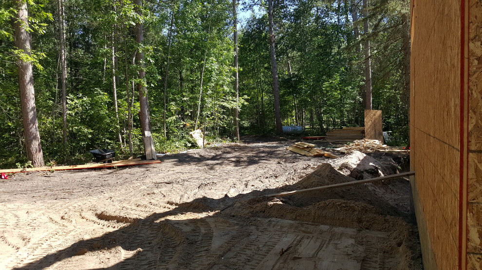 Inspiration for a rustic concrete fiberboard multicolored home design remodel in Minneapolis