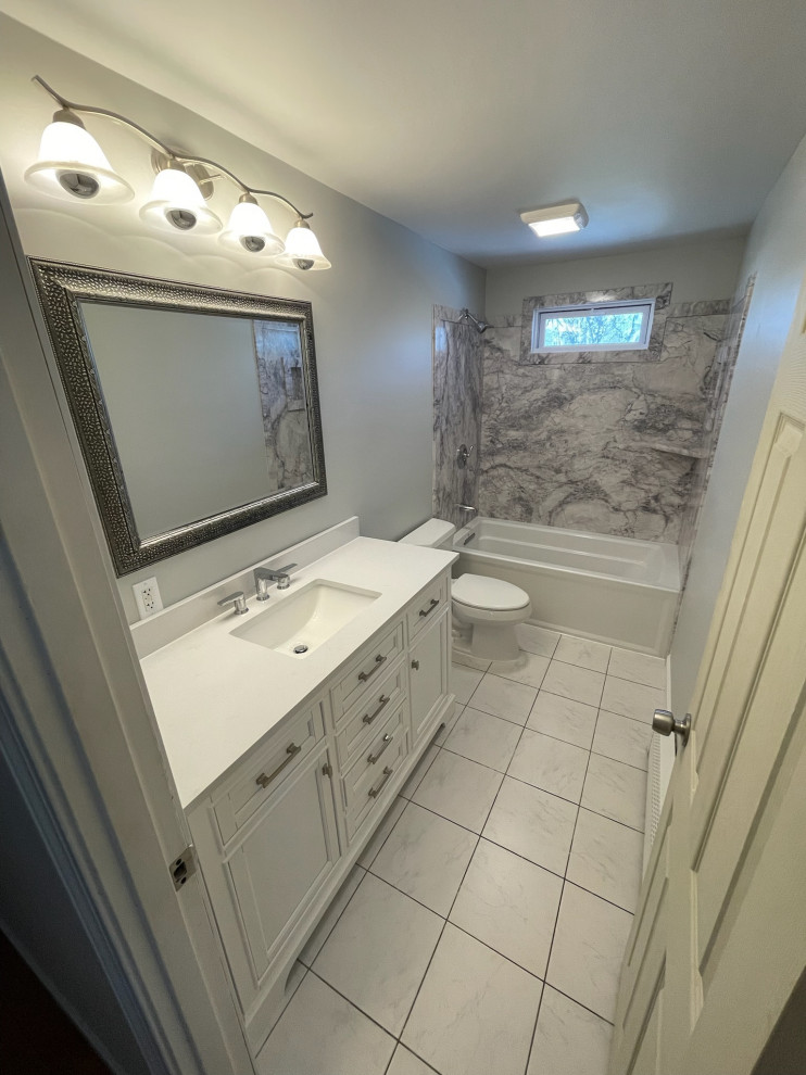 A bathroom with a bathtub and a sink