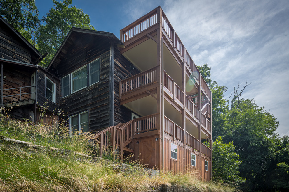 Inspiration for a huge rustic rooftop deck remodel in Charlotte