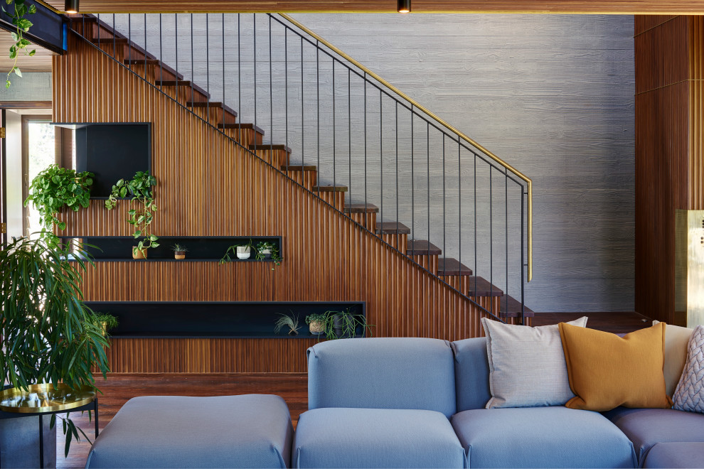 Inspiration for a mid-sized midcentury curved staircase in Perth with metal railing.