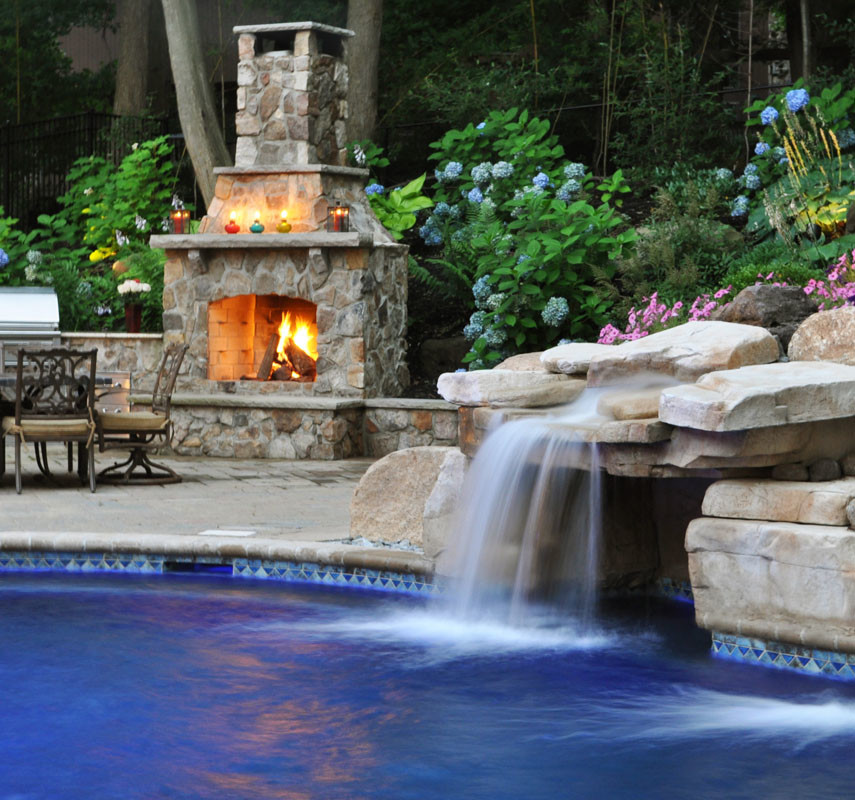 Large traditional backyard custom-shaped lap pool in New York with a water slide and gravel.