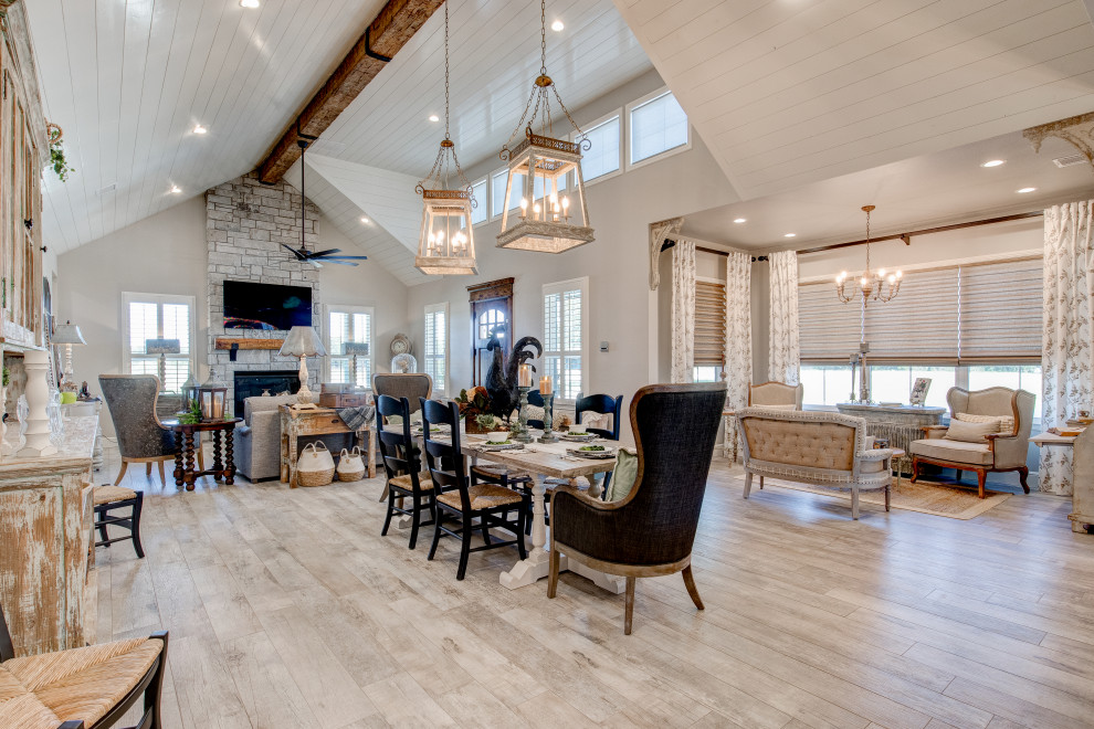This is an example of a mid-sized country open plan dining in Dallas with grey walls, ceramic floors, no fireplace, grey floor and timber.
