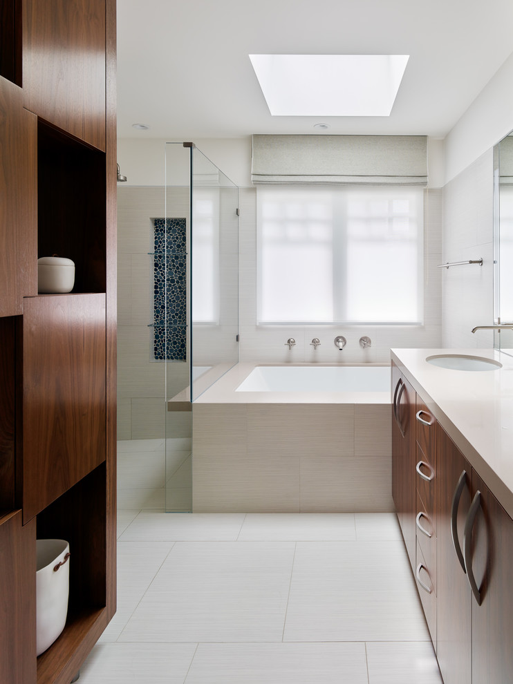 Inspiration for a contemporary master bathroom in San Francisco with flat-panel cabinets, dark wood cabinets, an undermount tub, an open shower, gray tile, beige walls, an undermount sink, beige floor and an open shower.