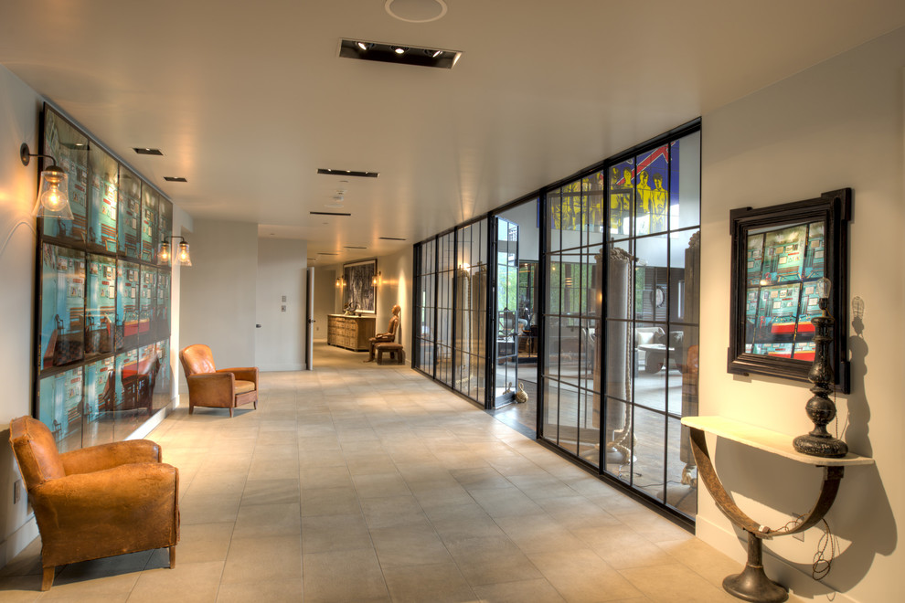 This is an example of an industrial foyer in Denver with a glass front door.