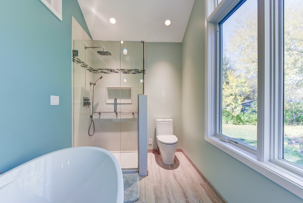 Mid-sized scandinavian master bathroom in Chicago with shaker cabinets, medium wood cabinets, a drop-in tub, a double shower, a one-piece toilet, ceramic floors, onyx benchtops, beige floor, a hinged shower door, white benchtops, a single vanity, a built-in vanity and vaulted.