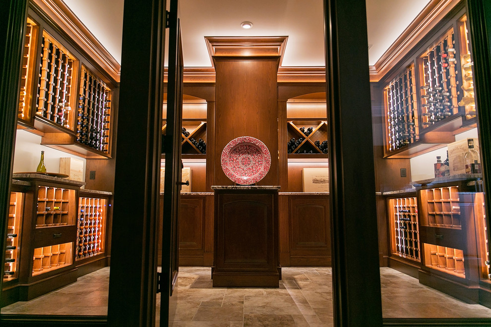 This is an example of a large traditional wine cellar in Chicago with diamond bins and brown floor.