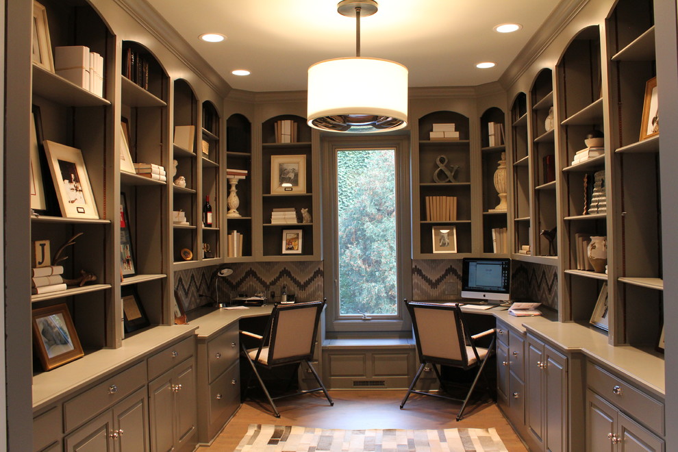 Transitional home office in Chicago with grey walls, no fireplace and a built-in desk.