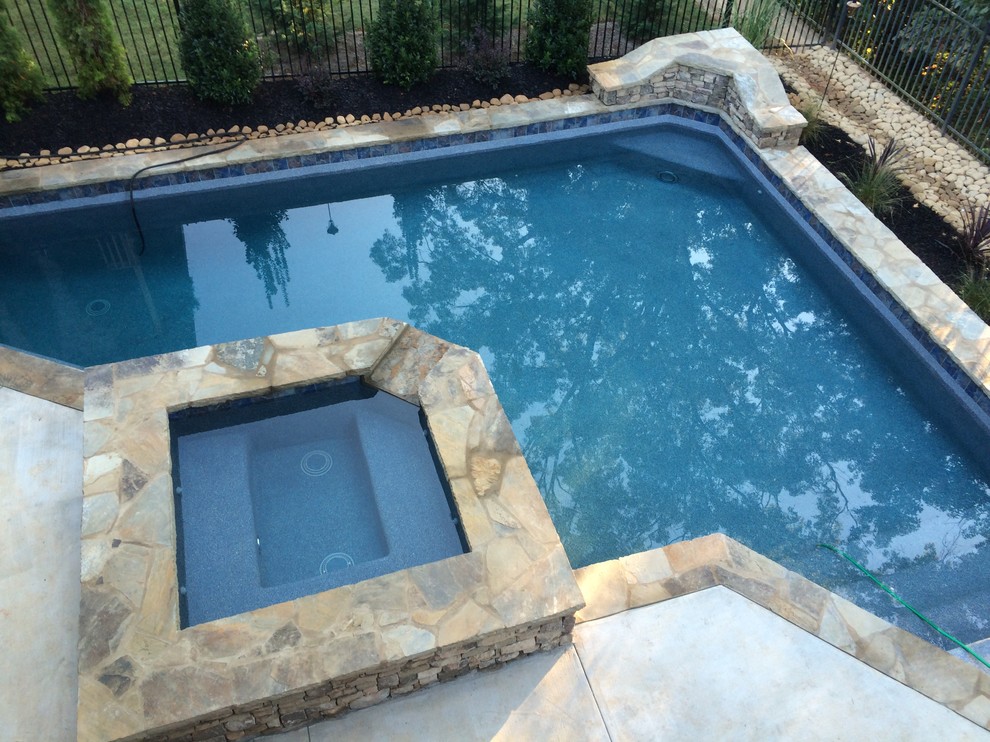 Inspiration for a small arts and crafts backyard custom-shaped natural pool in Atlanta with decking.