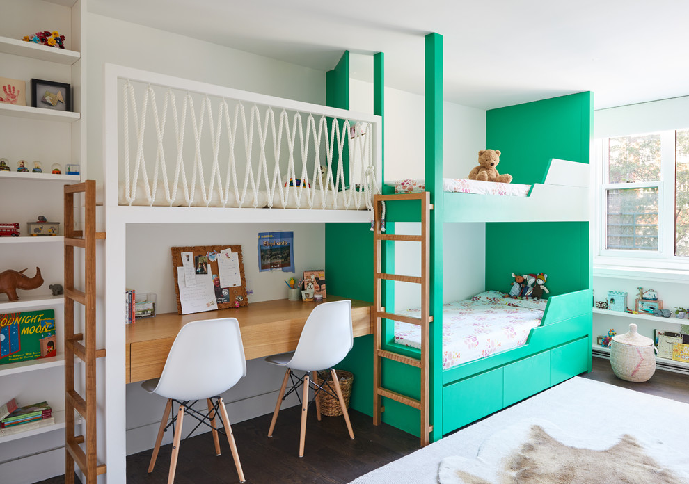 Example of a trendy gender-neutral dark wood floor and brown floor kids' bedroom design in New York with white walls