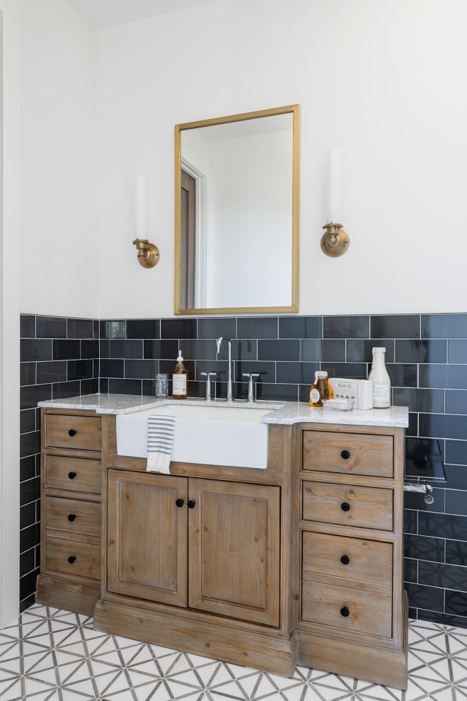 Example of a mid-sized transitional kids' white tile multicolored floor and single-sink bathroom design in Dallas with medium tone wood cabinets, a two-piece toilet, black walls, a built-in vanity and an undermount sink